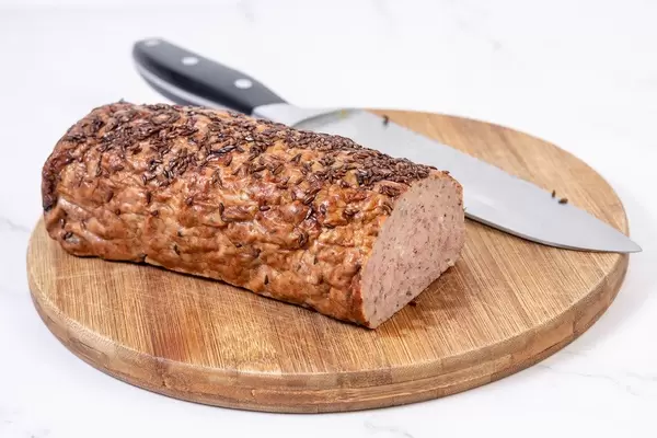 Pork and Chicken Meat Loaf with Cumin on the wooden board (Flip 2019)