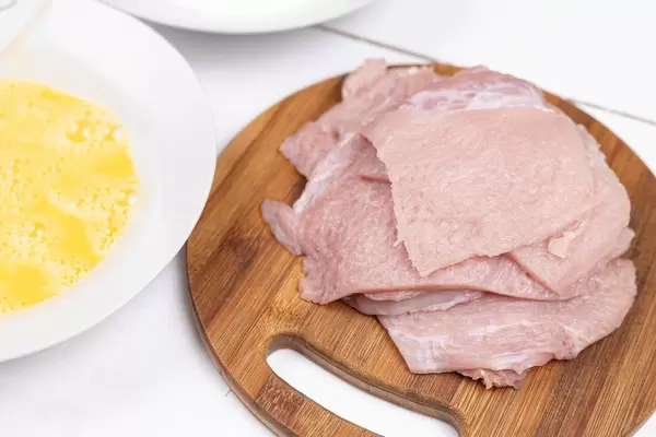 Pork Raw Meat on the round wooden board