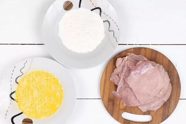 Pork Raw Meat with Flour and Eggs ready for frying