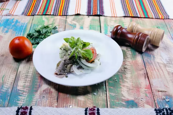 Pork steak with tomatoe, salt and pepper, wooden background (Flip 2019)