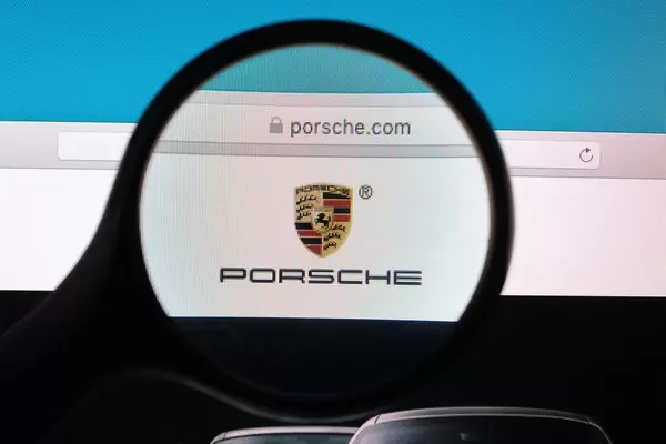 Porsche logo under magnifying glass