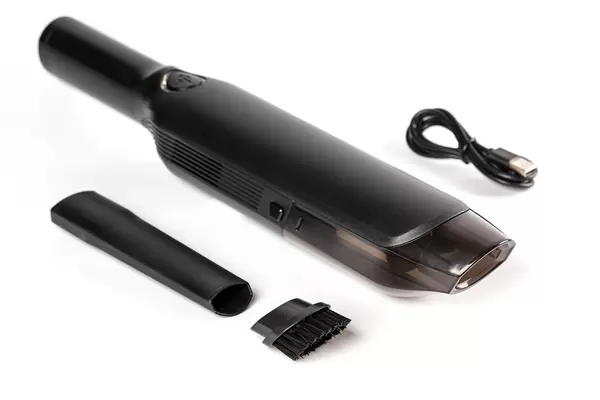 Portable small vacuum cleaner on white