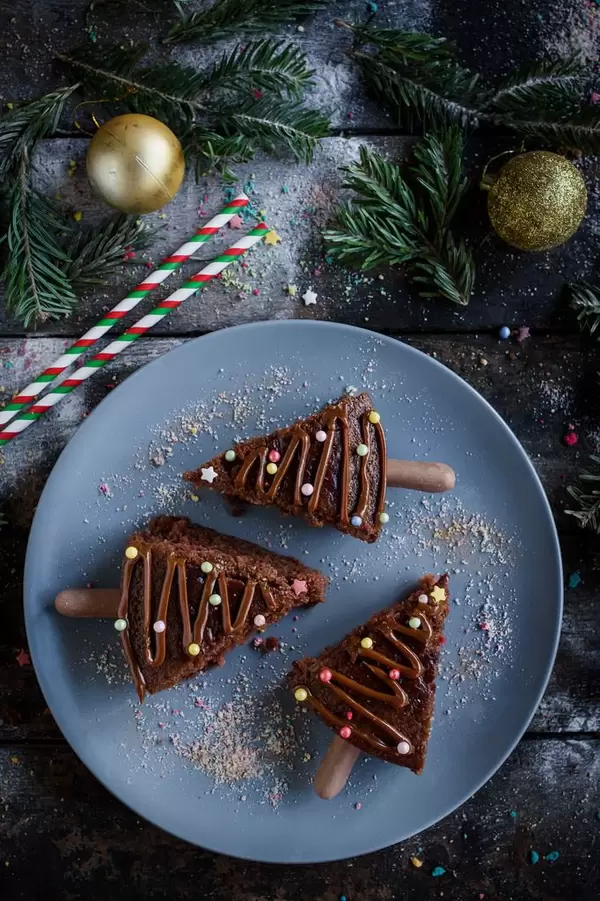 Portrait shot of Christmas chocolate cake on blue plate