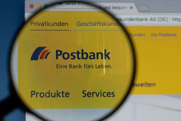 Postbank logo on a computer screen with a magnifying glass