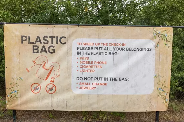 Poster with check-in instructions for quicker and safer check-in experience at the Tomorrowland Festival in Belgium