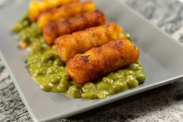 Potato Croquettes with Cooked Green Peas served on the plate (Flip 2019)
