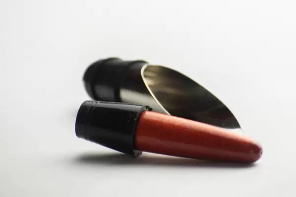 Pourer and stopper into the bottle of wine