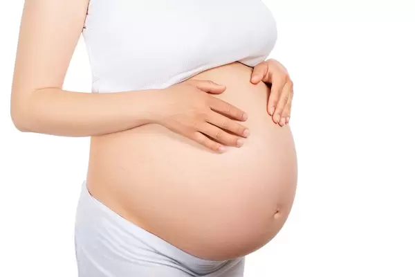 Pregnant woman on a white background
