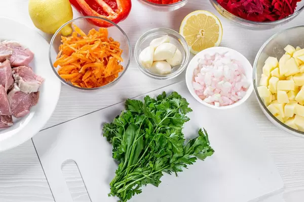 Prepared ingredients on the kitchen table for beet soup
