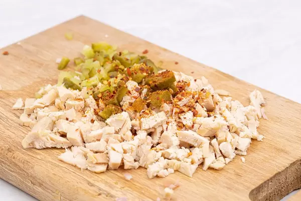 Preparing Chicken Meat salad with Pickles and Spicy Paprika