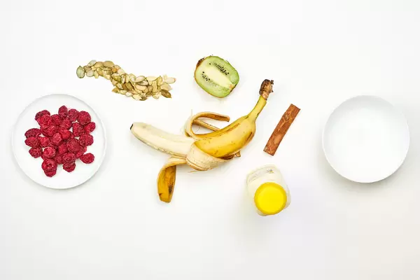 Preparing dieting milkshake with tropical fruits