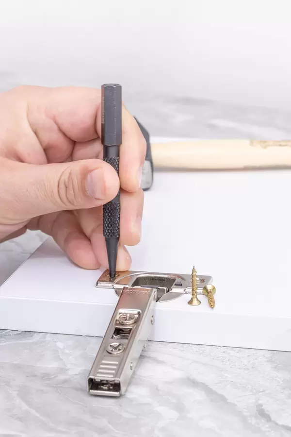 Preparing holes for Door Hinges