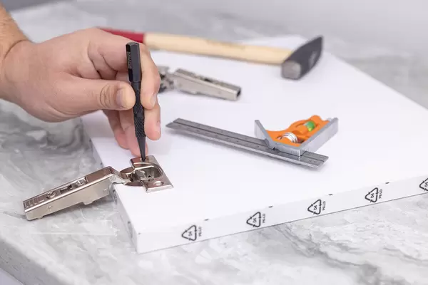 Preparing Holes for Screwdrivers on the Hinges