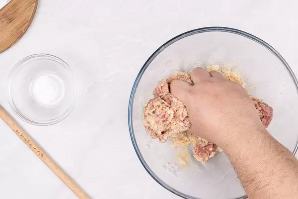 Preparing Meat Balls with minced meat onion and bread crumbs with hand