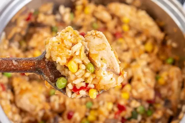 Preparing Risotto with Chicken Meat in the pot