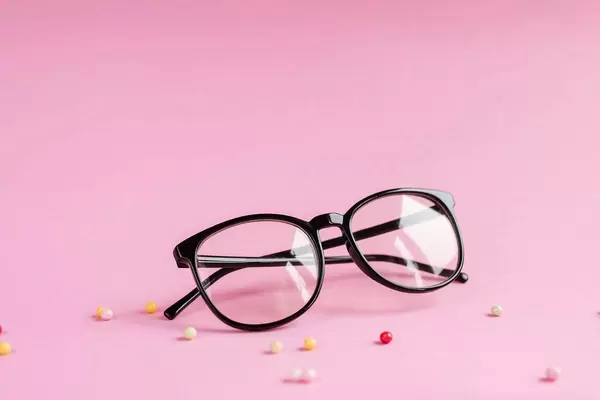 Product shot of glasses on pink background.