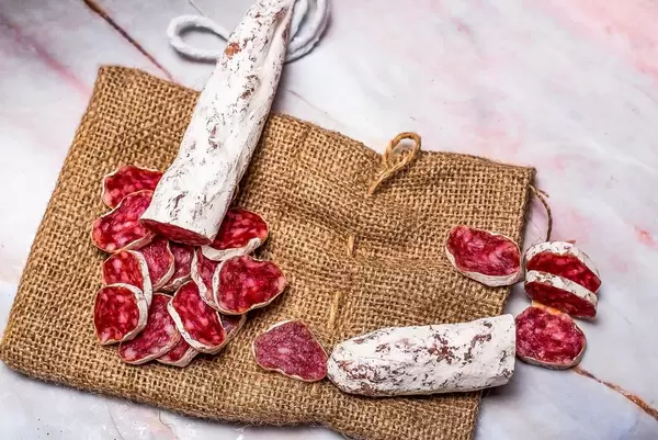 Prosciutto pieces on linen cloth