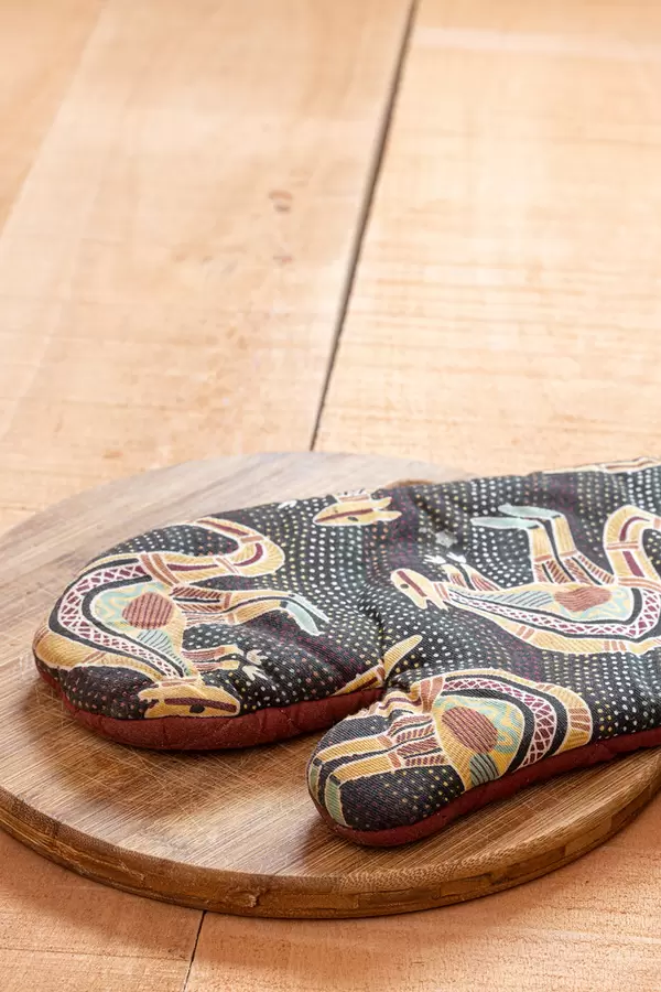 Protective Kitchen Glove on the wooden board with copy space