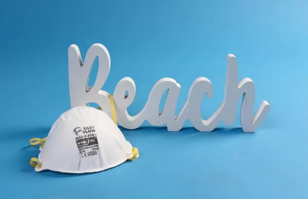 Protective mask Beach text on blue background
