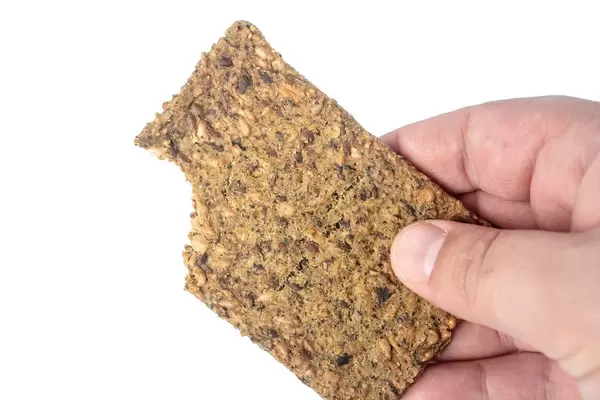Protein Bar with Pumpkin Seeds above white background (Flip 2019)