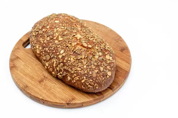 Protein Bread with Pumpkin seed on the wooden board (Flip 2019)