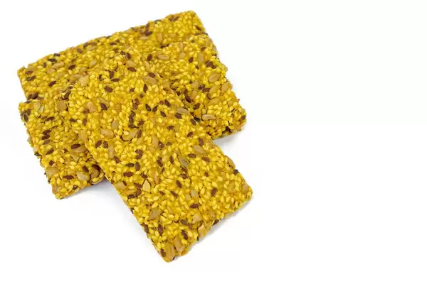 Protein Curcuma Cereals Crackers above white background (Flip 2019)
