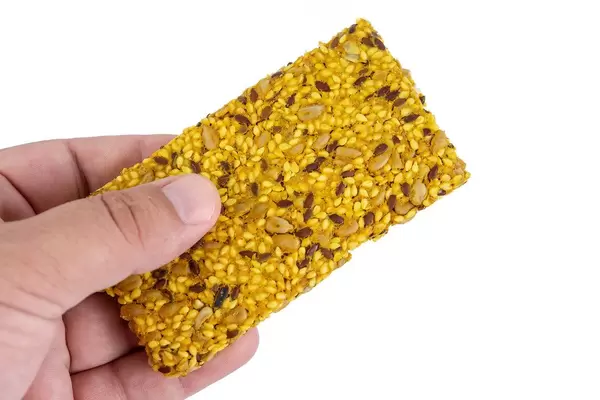 Protein Curcuma Cereals Crackers in the hand