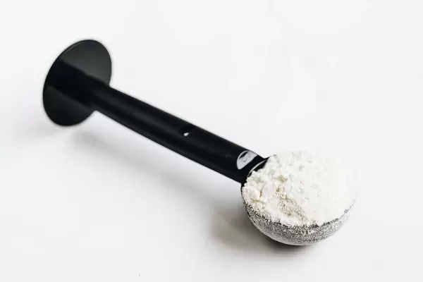 Protein powder in a spoon