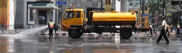 Public servants washing a street in Thailand