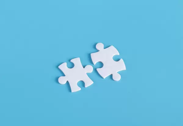 Puzzle pieces on blue background