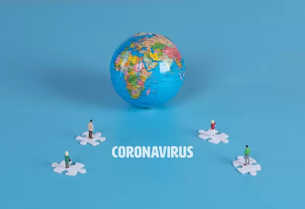 Puzzle pieces with globe and Coronavirus text