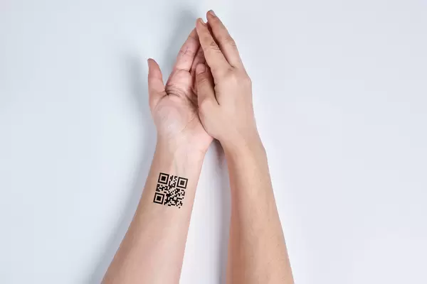 QR code on the wrist - concept of chipping