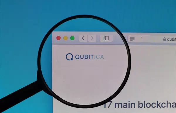QUBITICA logo under magnifying glass