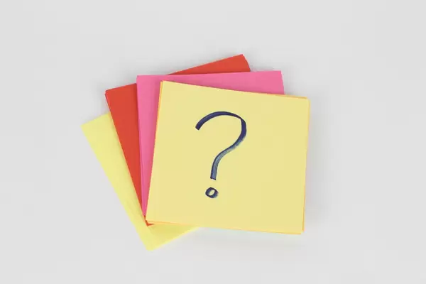 Question mark on sticky note