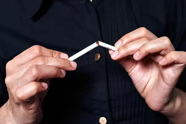 Quit smoking - hands breaking up cigarette