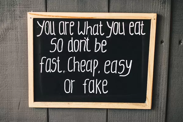 "Your are what you eat so do not be fast, cheap, easy or fake" chalkboard sign
