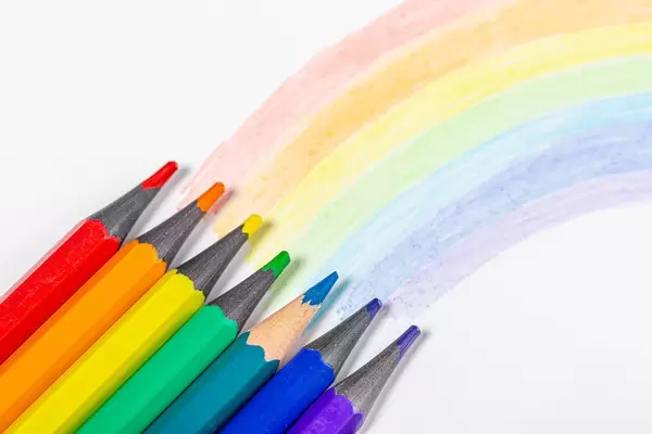 Rainbow and pencils of rainbow colors on white background (Flip 2019)