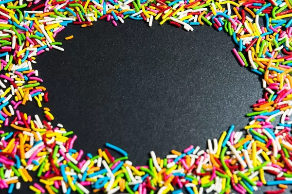 Rainbow sprinkles forming a frame