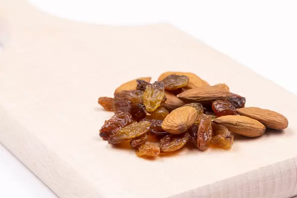 Raisins and Almonds on the wooden board