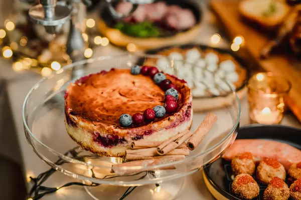 Rasberry Cheese Cake With Blueberries On Glass Plate