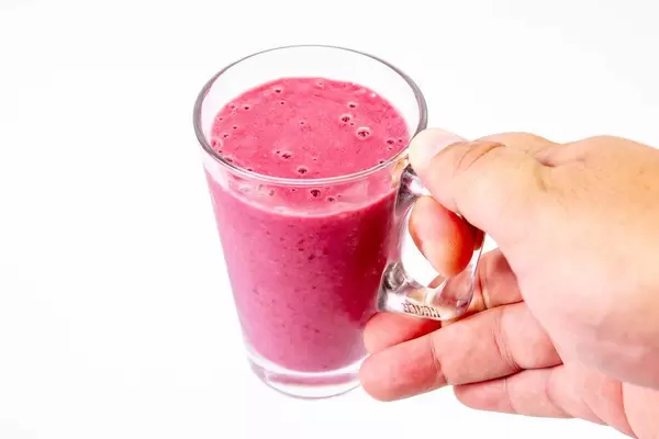 Raspberry Banana and Blackberry Smoothie in the hand (Flip 2019)