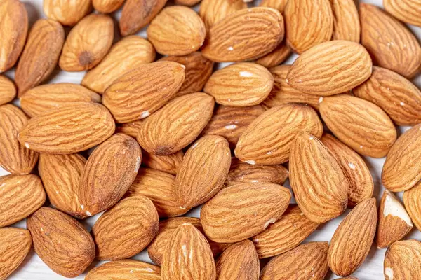 Raw almond nuts background. Top view (Flip 2019)