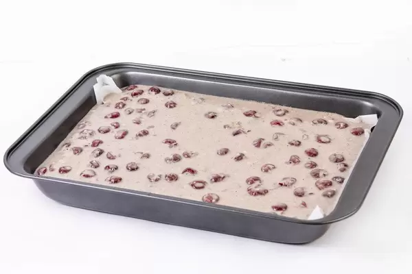 Raw Cake Mixture with cherries ready for baking (Flip 2019)