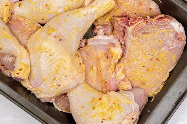 Raw Chicken and Pork meat ready for baking