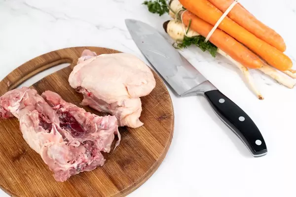 Raw Chicken Backs with vegetables prepared for cooking soup (Flip 2019)