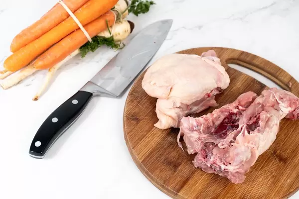 Raw Chicken Backs with vegetables prepared for cooking soup