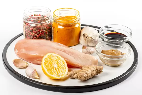 Raw chicken fillet breast and spiced