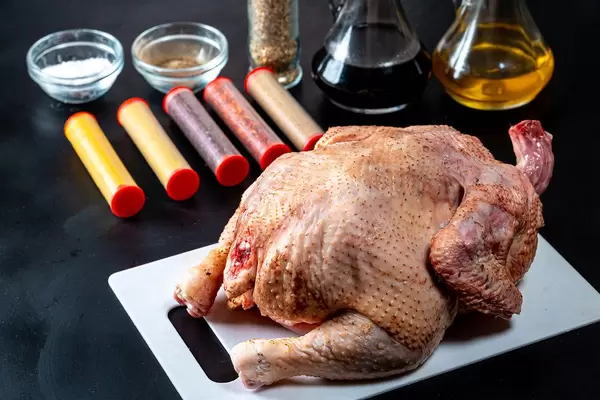 Raw chicken with ingredients on black background (Flip 2019)