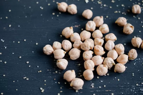 Raw chickpeas on dark background