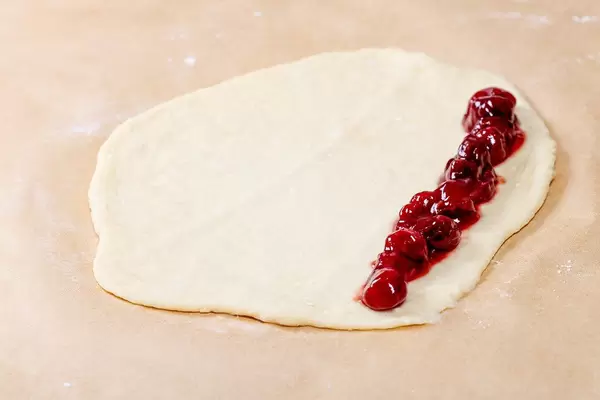 Raw dough for buns with cherry jam (Flip 2019)